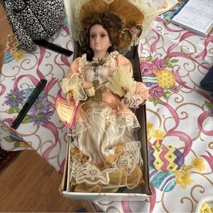 Porcelain Victorian-Style Doll in Peach and Cream Dress